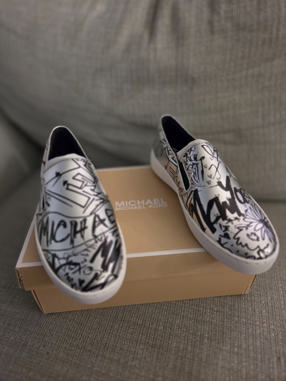 Michael Kors  White Slip-On Sneakers with Black Graffiti